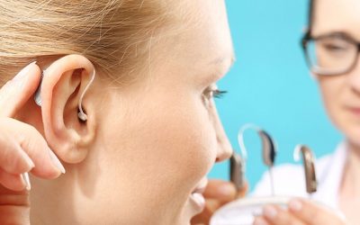 Investigating Human-Body Communications Using Binaural Hearing Aids